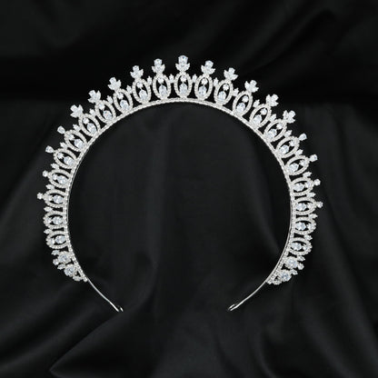 Vintage-inspired Crown with intricate arched frames and refined elevated accents