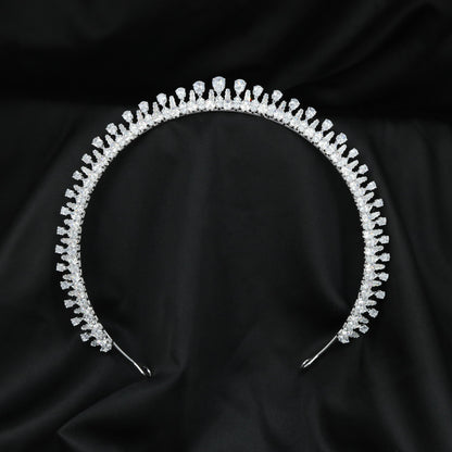 Grand wedding Crown featuring delicate upright elements and a prominent raised centre