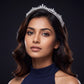 Signature Crown crafted with intricate openwork patterns and a prominent raised centre detail