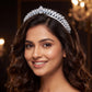 Royal Crown featuring a curved openwork band with repeating leaf-like accents