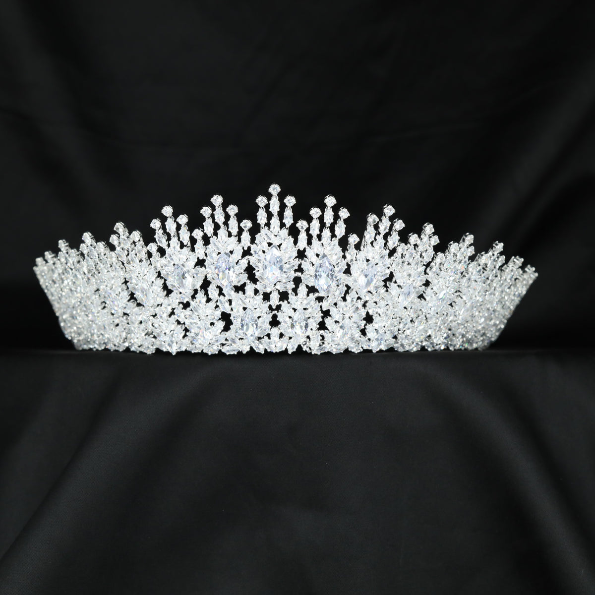 Grand floral crown with layered blooms, fine botanical elements and graceful upward detailing
