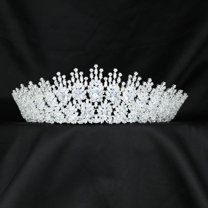 Grand floral crown with layered blooms, fine botanical elements and graceful upward detailing