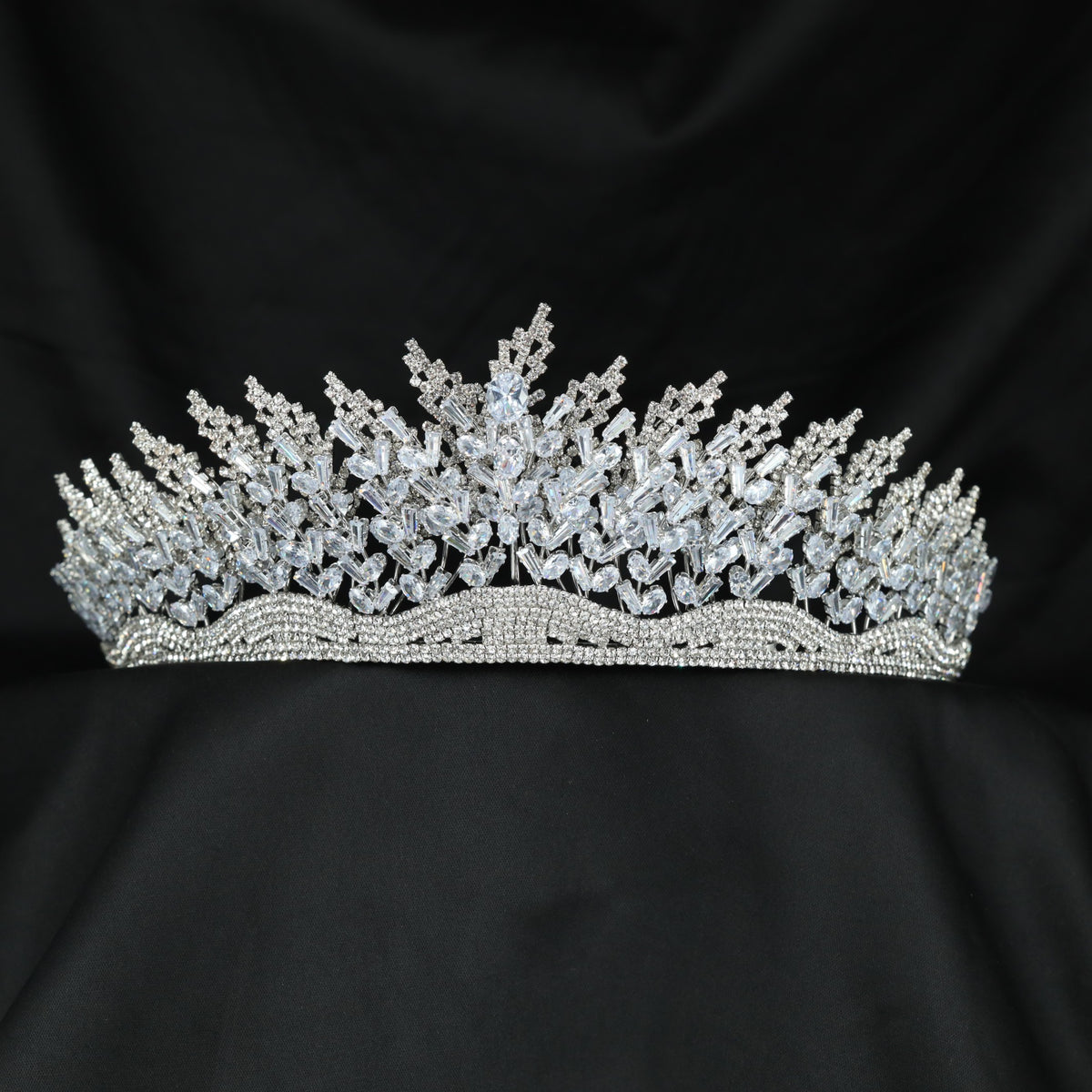 Grand openwork crown with ascending botanical sprays and richly detailed sculpted centre