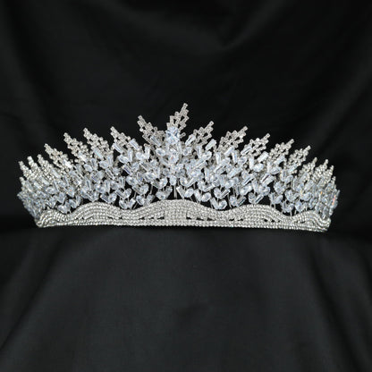Grand openwork crown with ascending botanical sprays and richly detailed sculpted centre