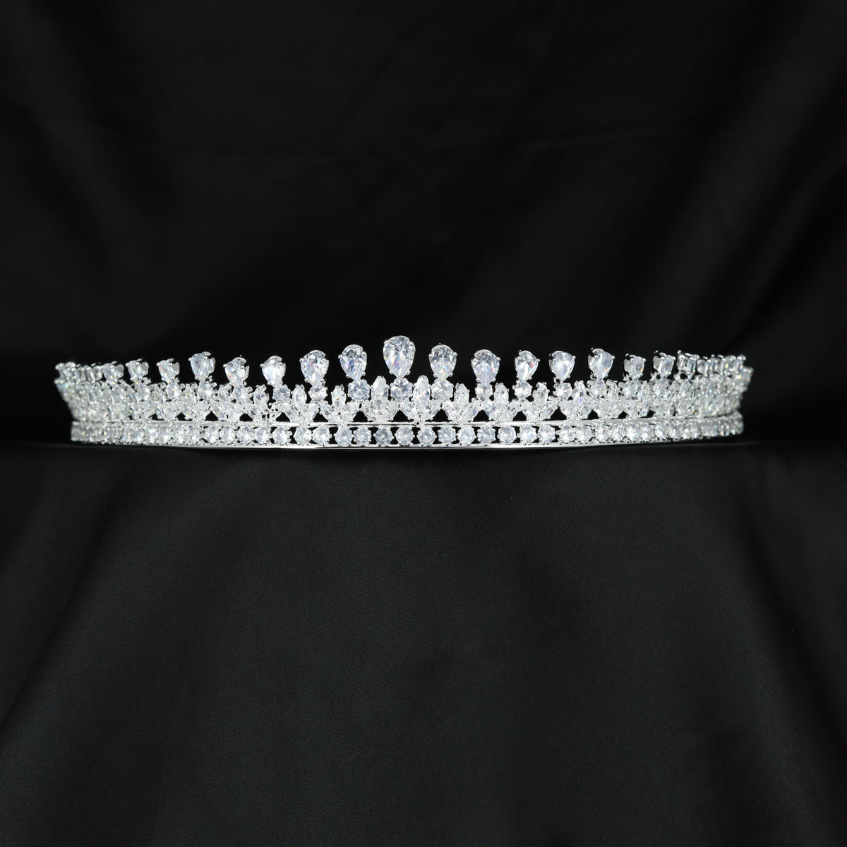 Classic openwork crown with elegant teardrop stone accents