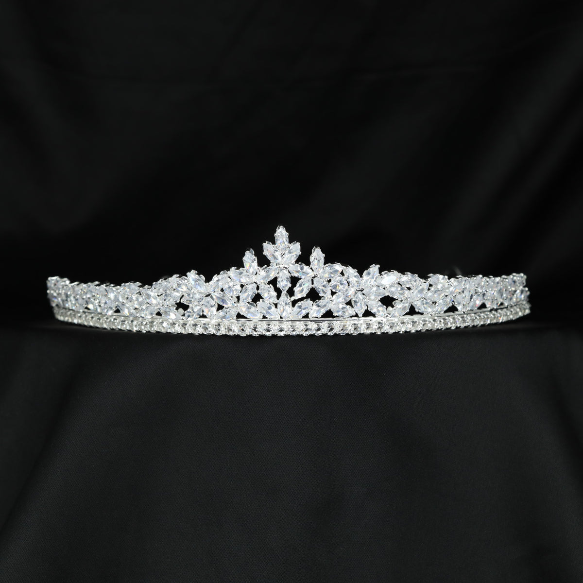 Floral crystal crown with delicate leaf clusters and a graceful symmetrical design