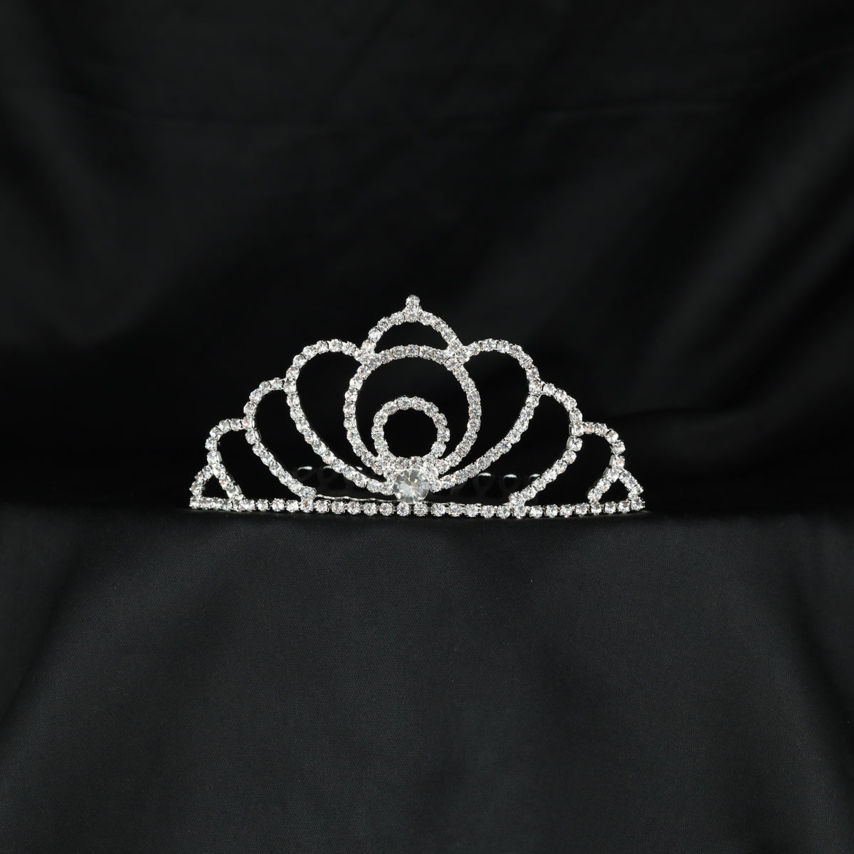 Elegant statement crown with sweeping petal inspired arches and a circular centre
