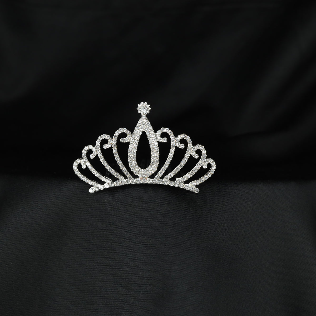 Radiant openwork crown with a tall central teardrop design and sparkling crystal detailing