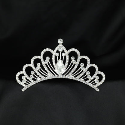 Graceful crystal crown with repeated curved arches and a prominent centre accent