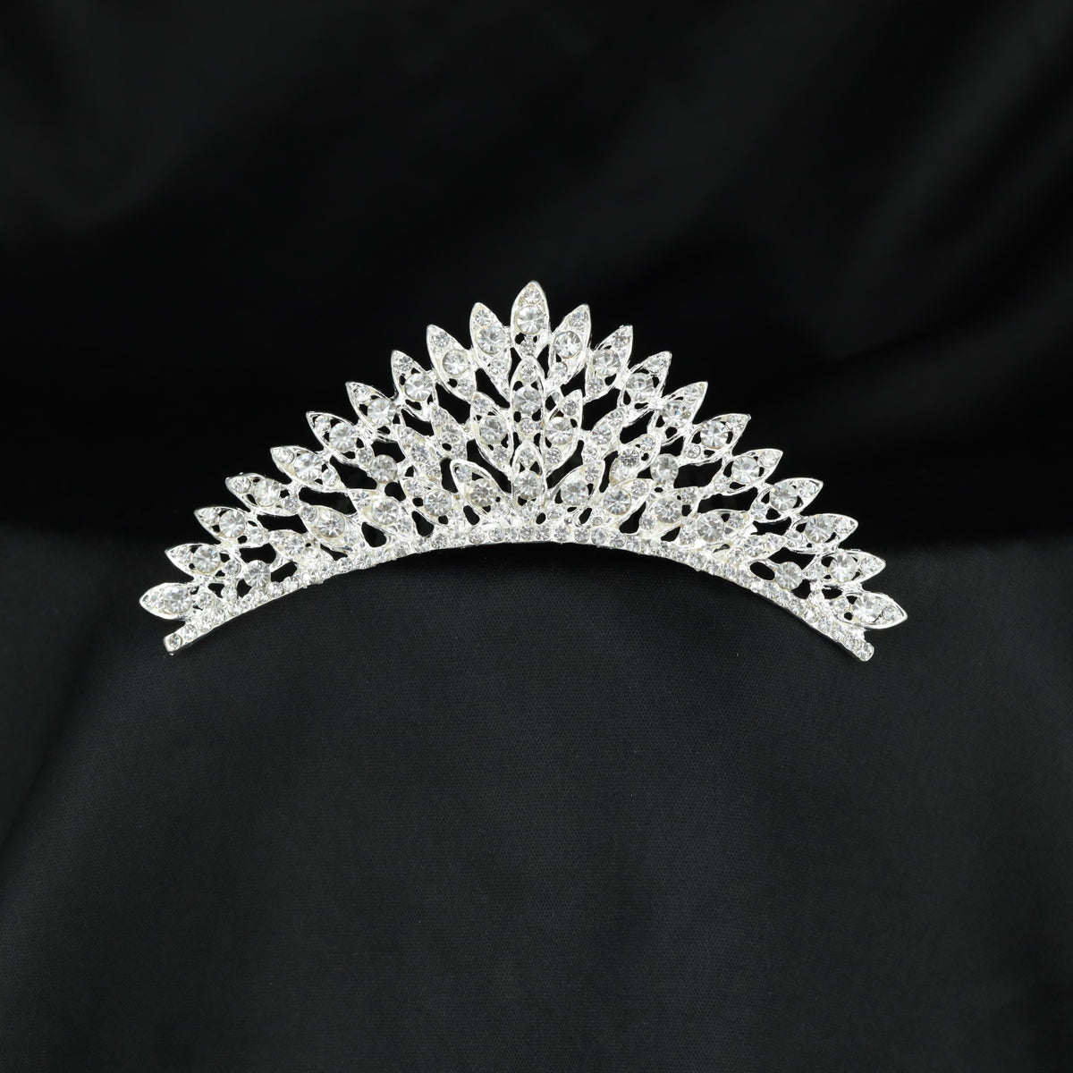 Floral foliage crown with pointed leaf elements and intricate sparkling accents