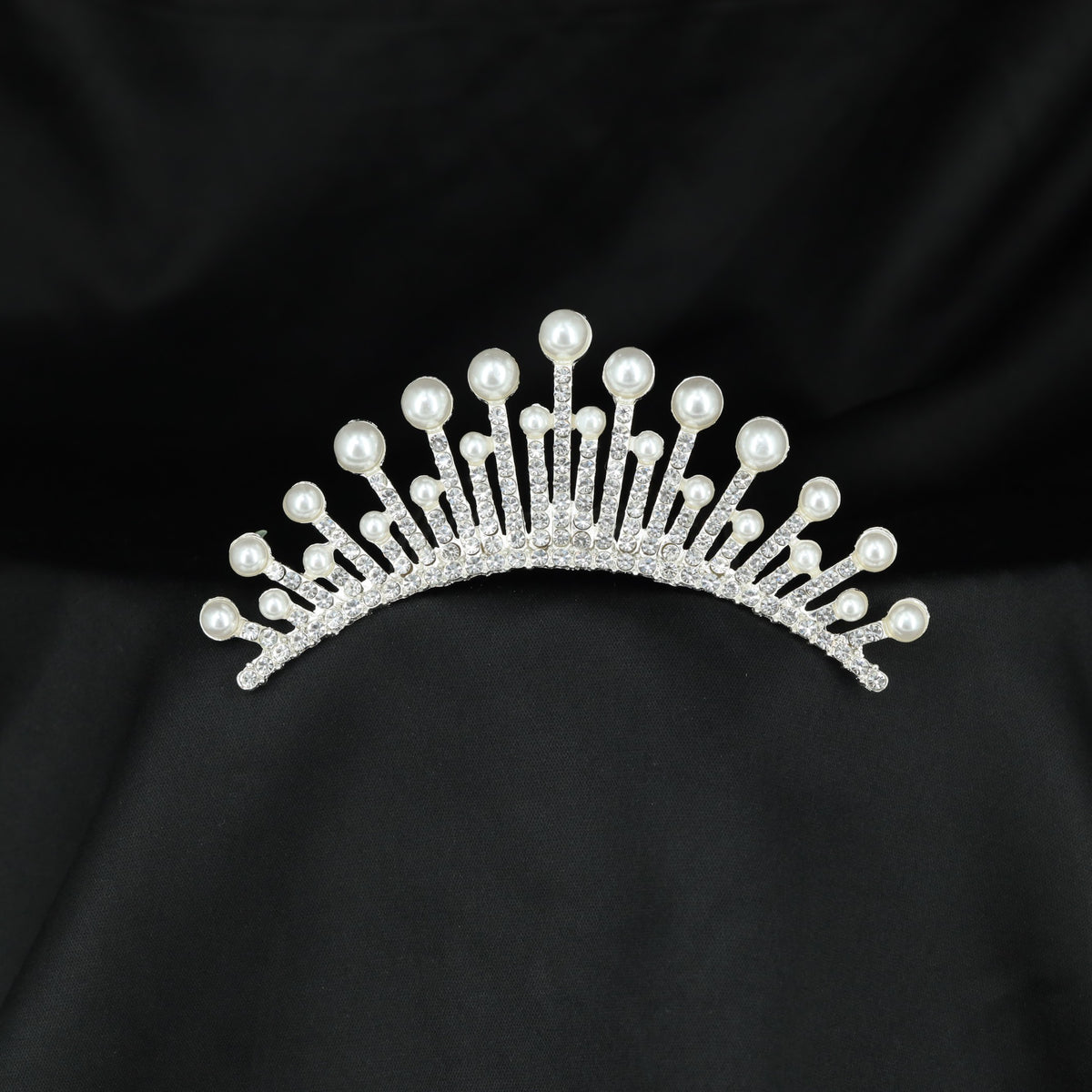 Pearl tipped radiant crown with sparkling crystal arches and elegant openwork detailing