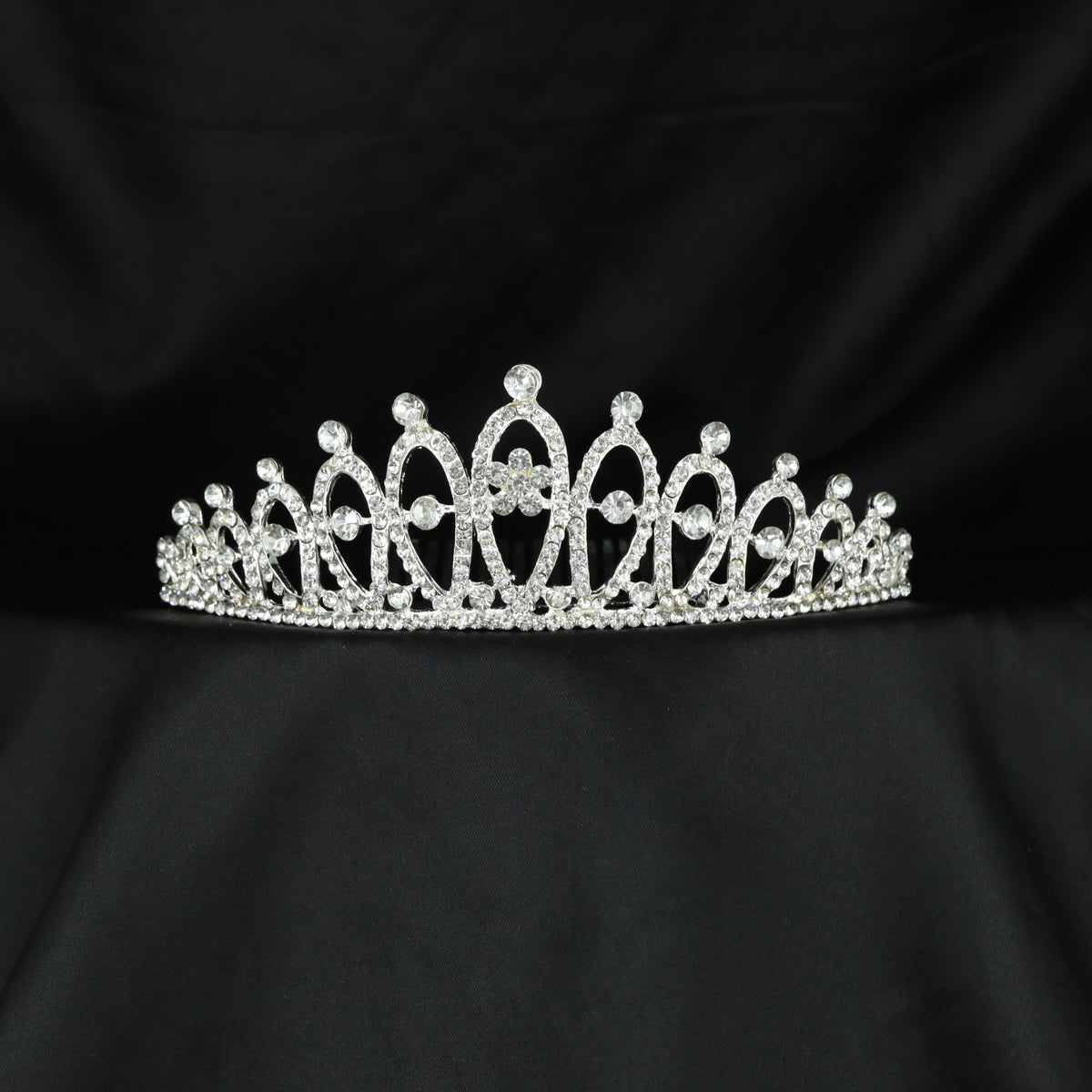 Classic openwork crown with graduated arches and refined crystal embellishments
