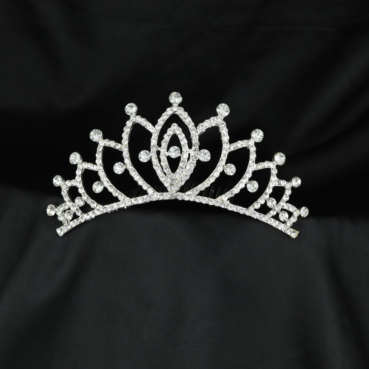 Regal lotus inspired crown with symmetrical arches and refined stone accents