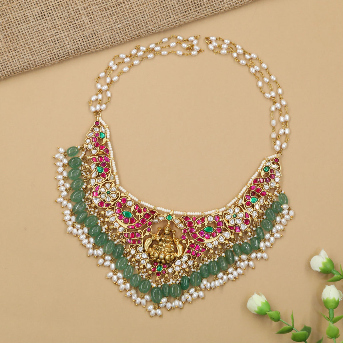 Grand jadau necklace featuring an elaborate Lakshmi centre and pearl embellishment