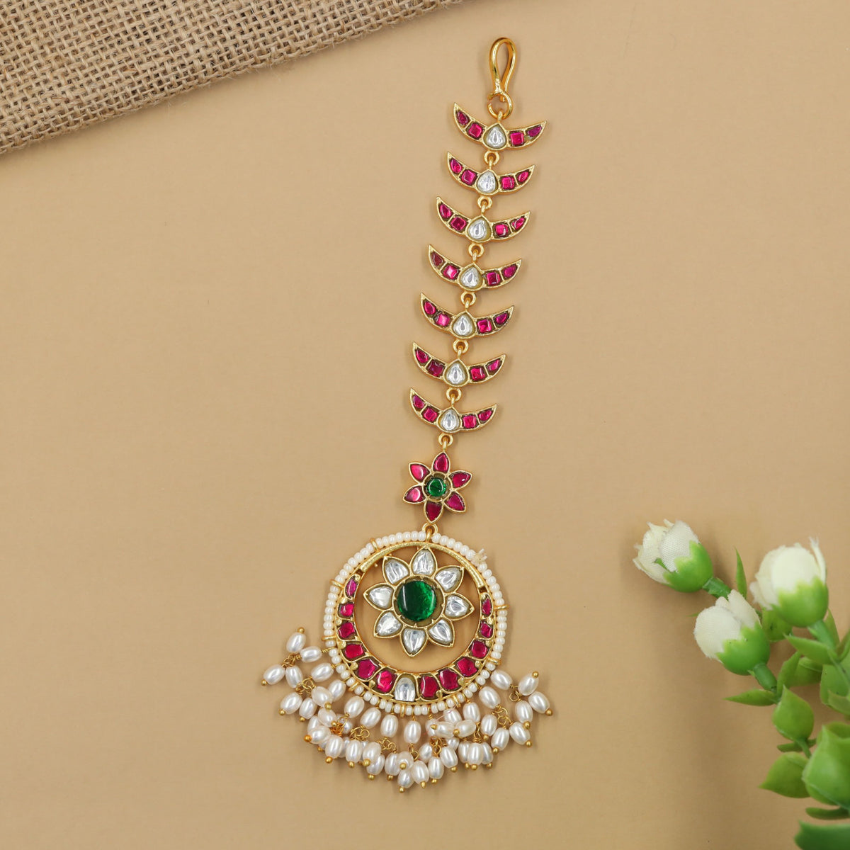 Royal jadau tikka with intricate pendant detailing and pearl fringe
