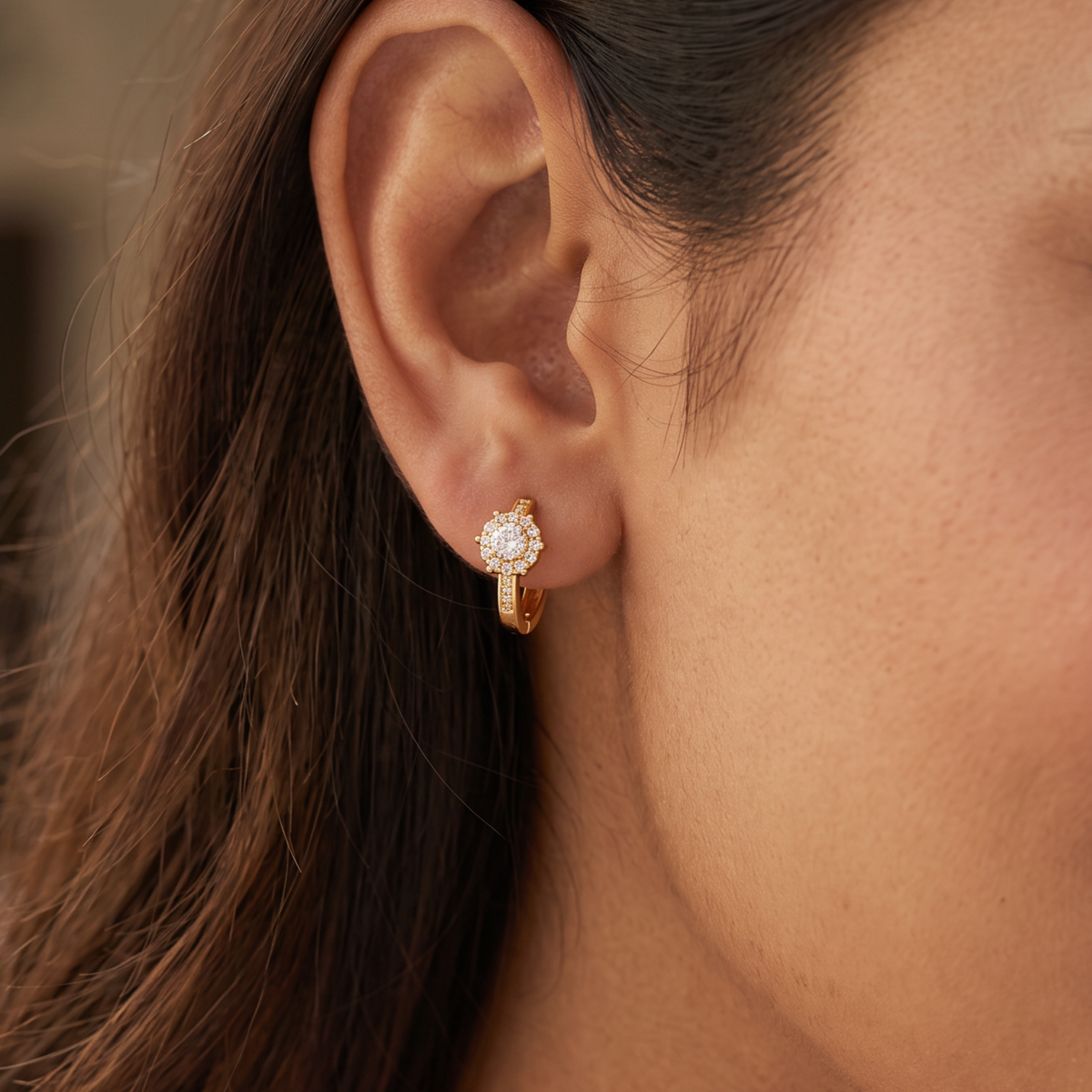 A Refined Round Stone Cluster With Gold Polish Bali Hoop Styling