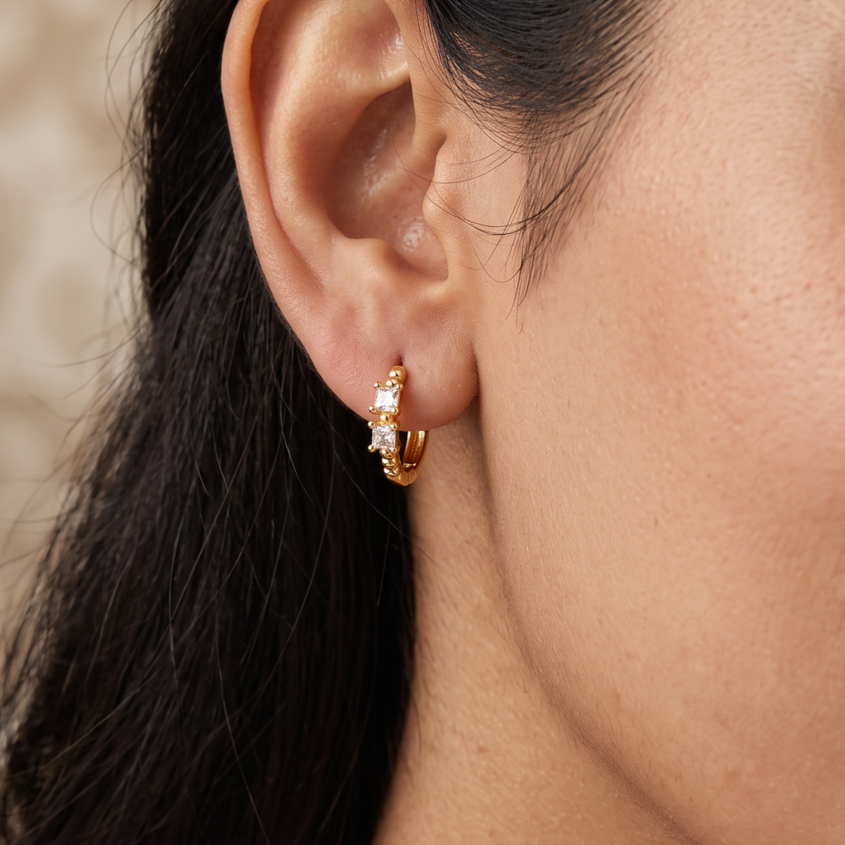A beaded hoop with a sparkling centre in Gold Polish Bali