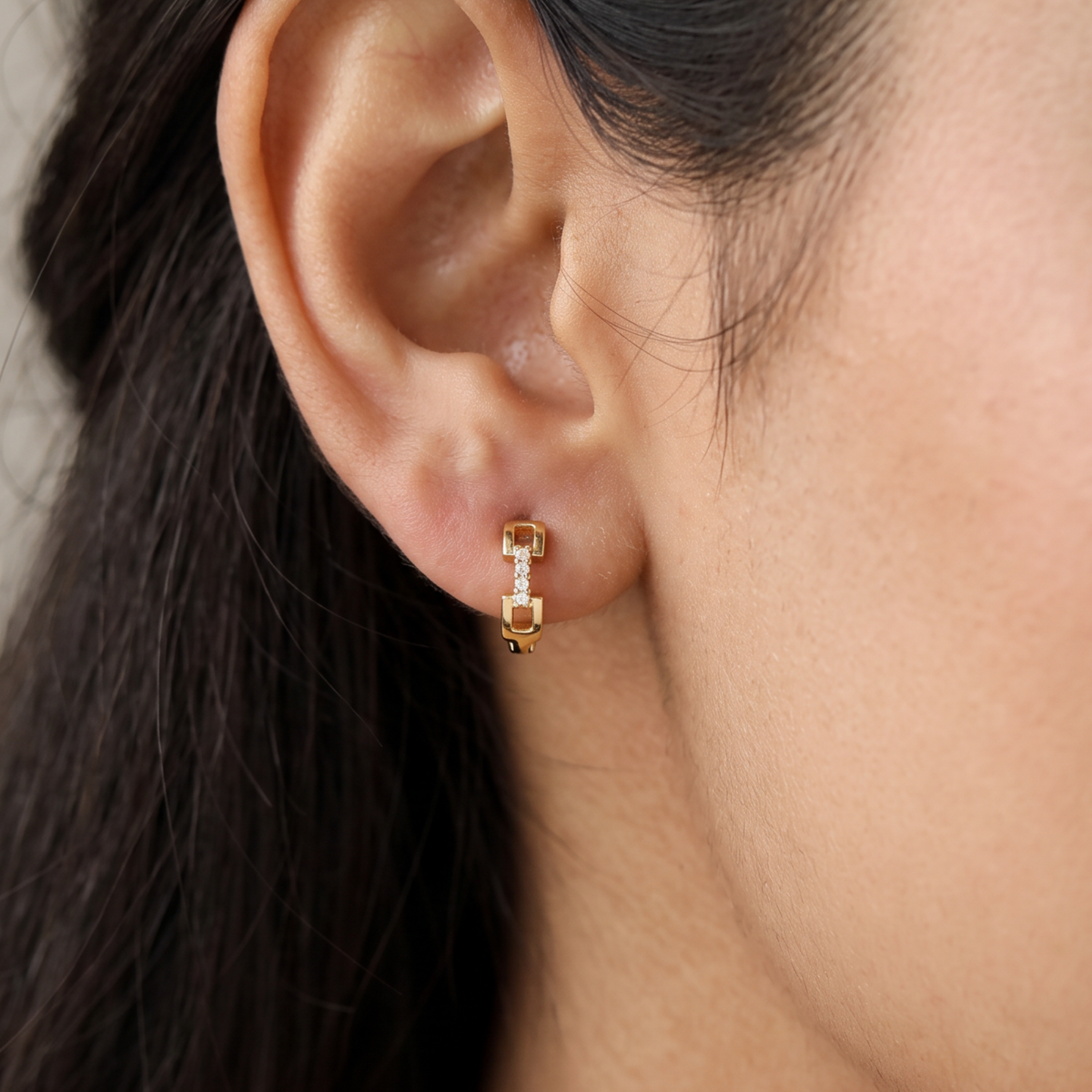 A modern link-inspired design with Gold Polish Bali and fine stone accents