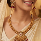 Dense bead kundan necklace with structured rows and scalloped pendant fringe