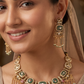 Decorative oval kundan necklace with linked panels and layered fringe drops