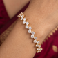 Sleek Gold Tone Bangle with Uniform Round Stone Alignment