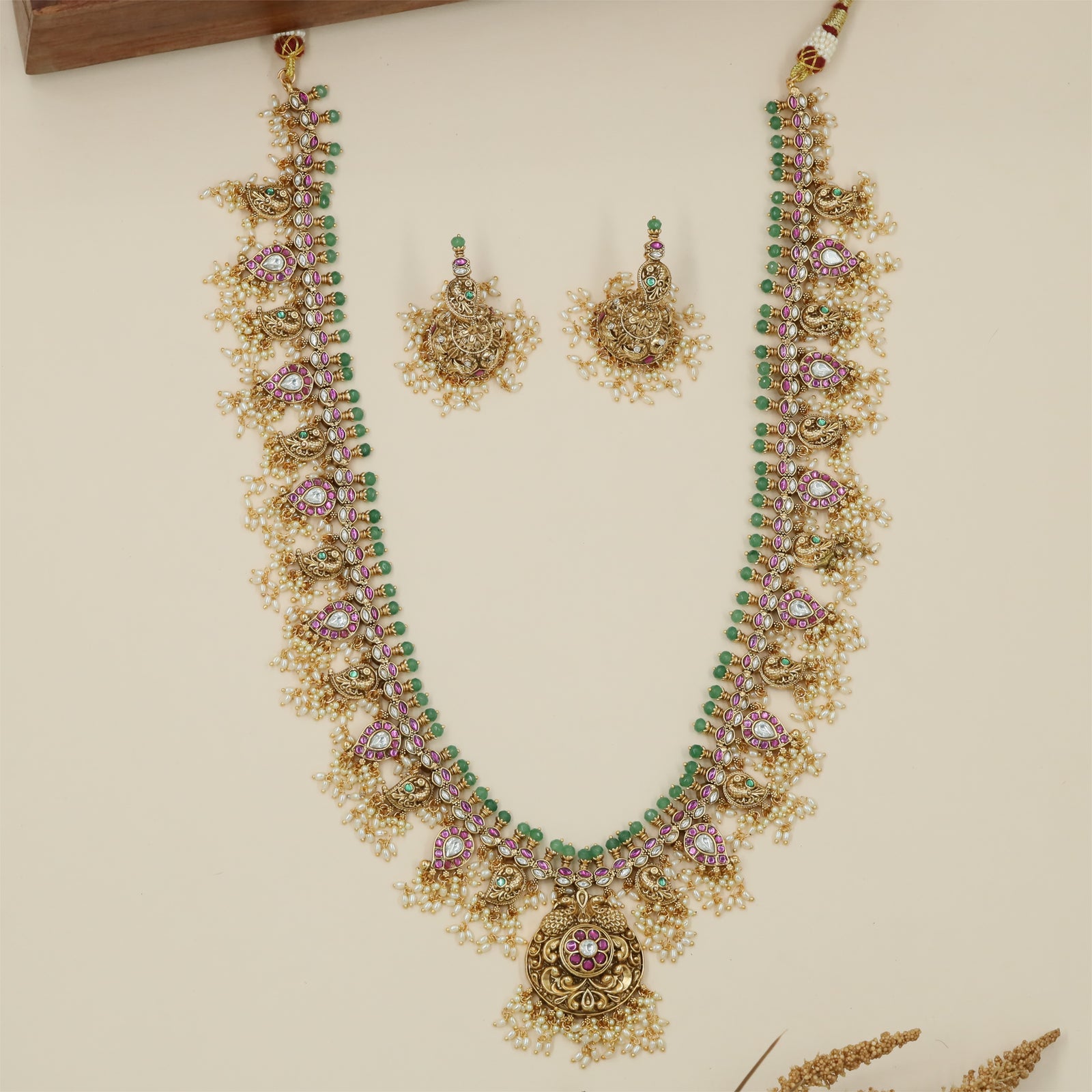 Antique Long Haara with Circular Pendant Detailing and Pearl Fringe Texture