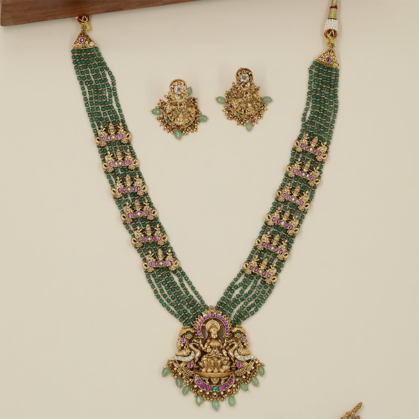 Aadishree Lakshmi Antique Beads Long Haara with Multi Strand Bead Rows and Grand Pendant Detailing