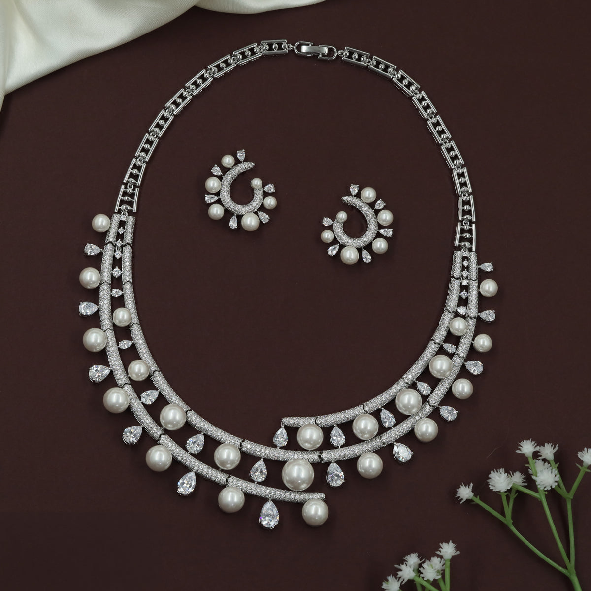 Elegant Rhodium Necklace with Graduated Pearl Drops