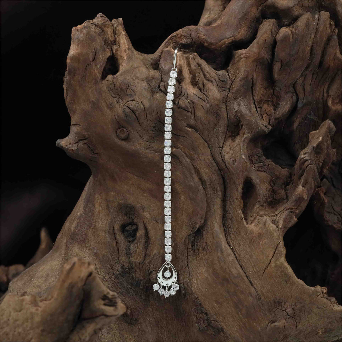 Rhodium Tikka featuring a teardrop frame