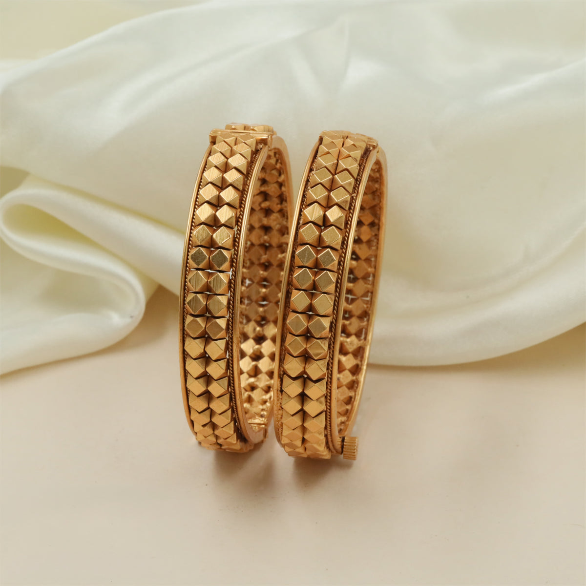 Repeated Geometric Antique Bangles with Textured Finish