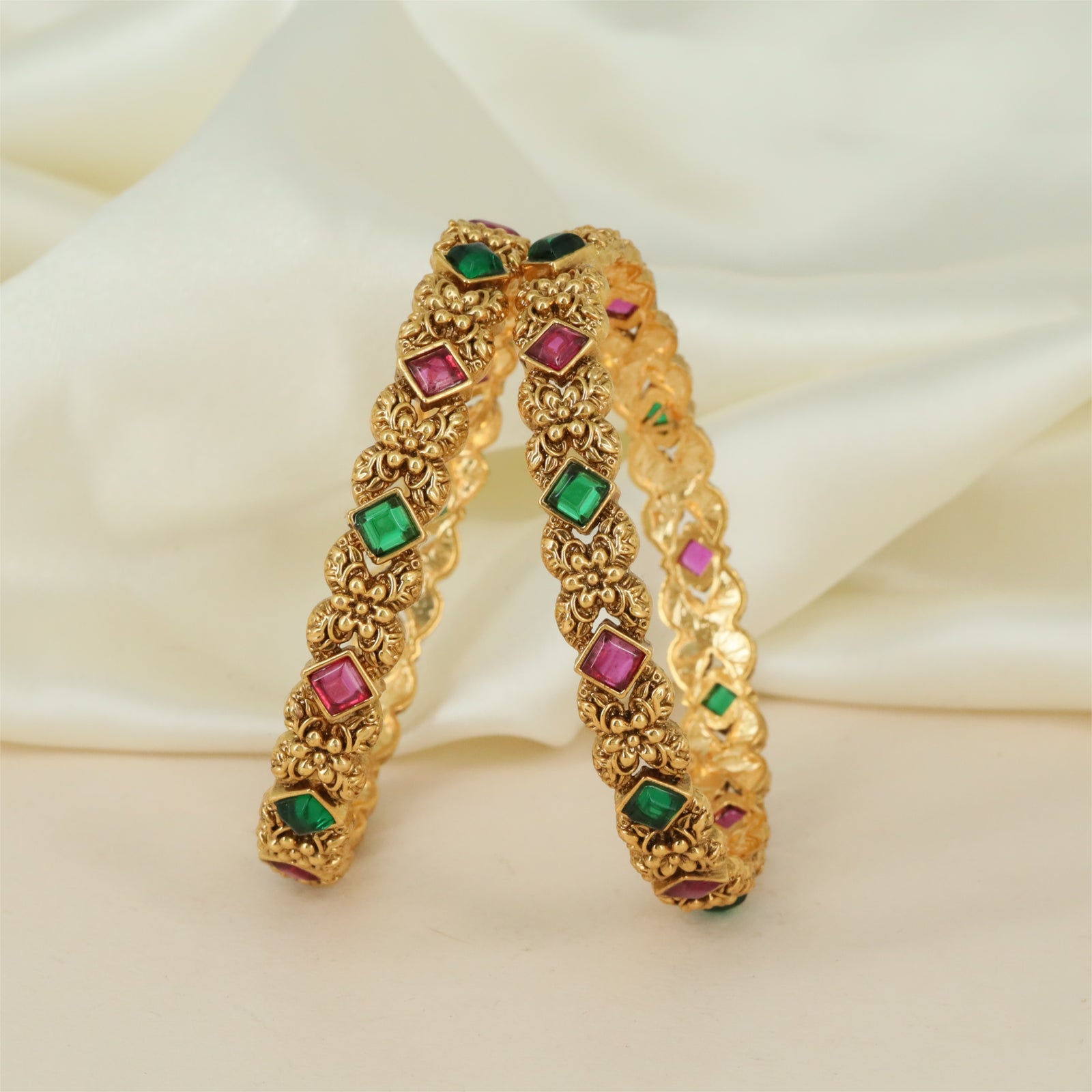 Antique Frame Bangles with Raised Floral Work and Oval Accent Placement