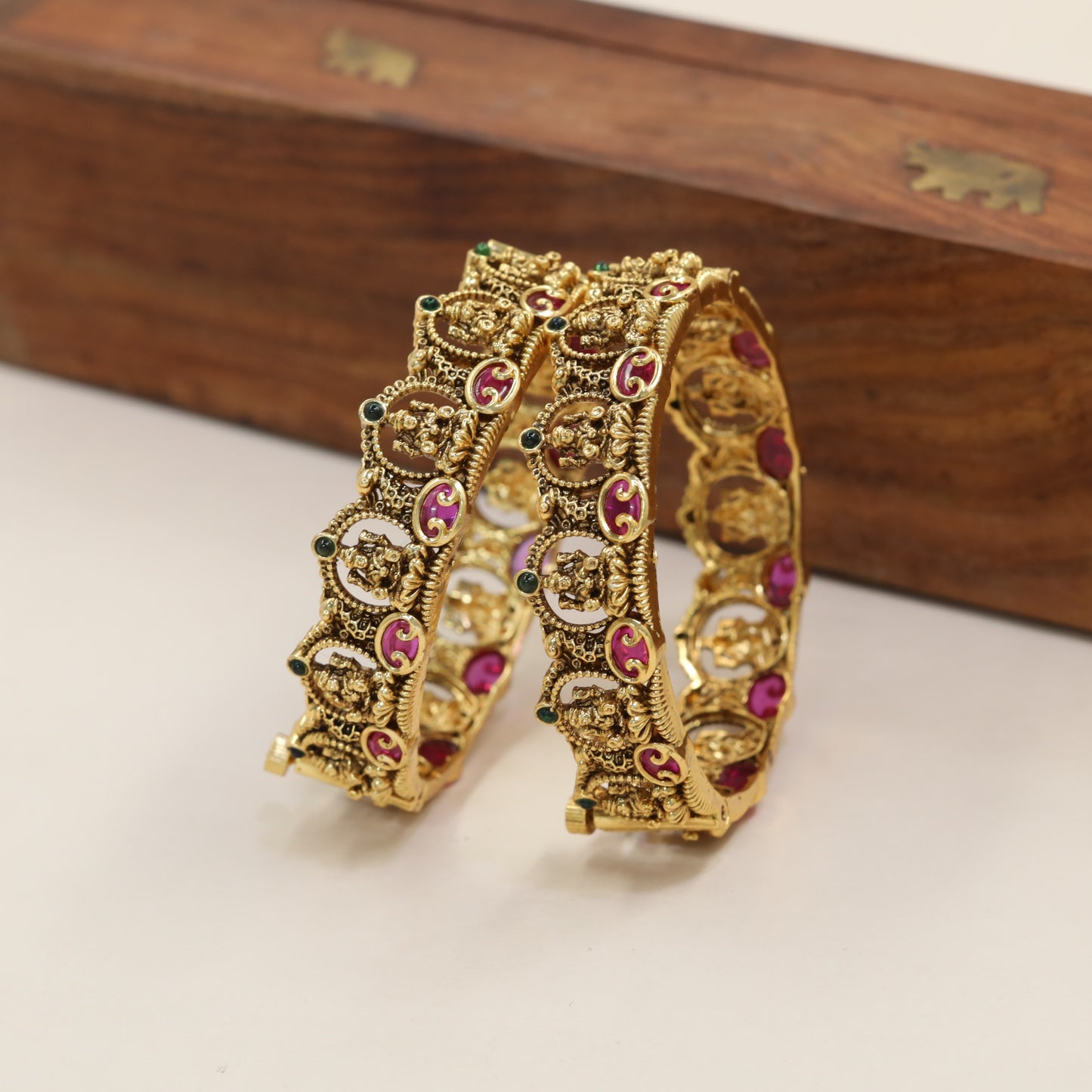 Classic Antique Bangles With Sculpted Panel Work And Curved Borders