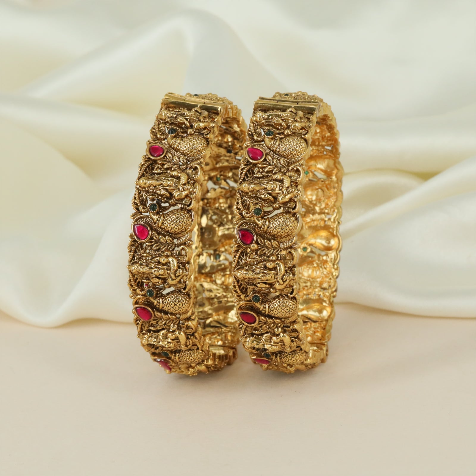 Chaitrali Antique Bangles with Structured Fish Sections and Floral Texture
