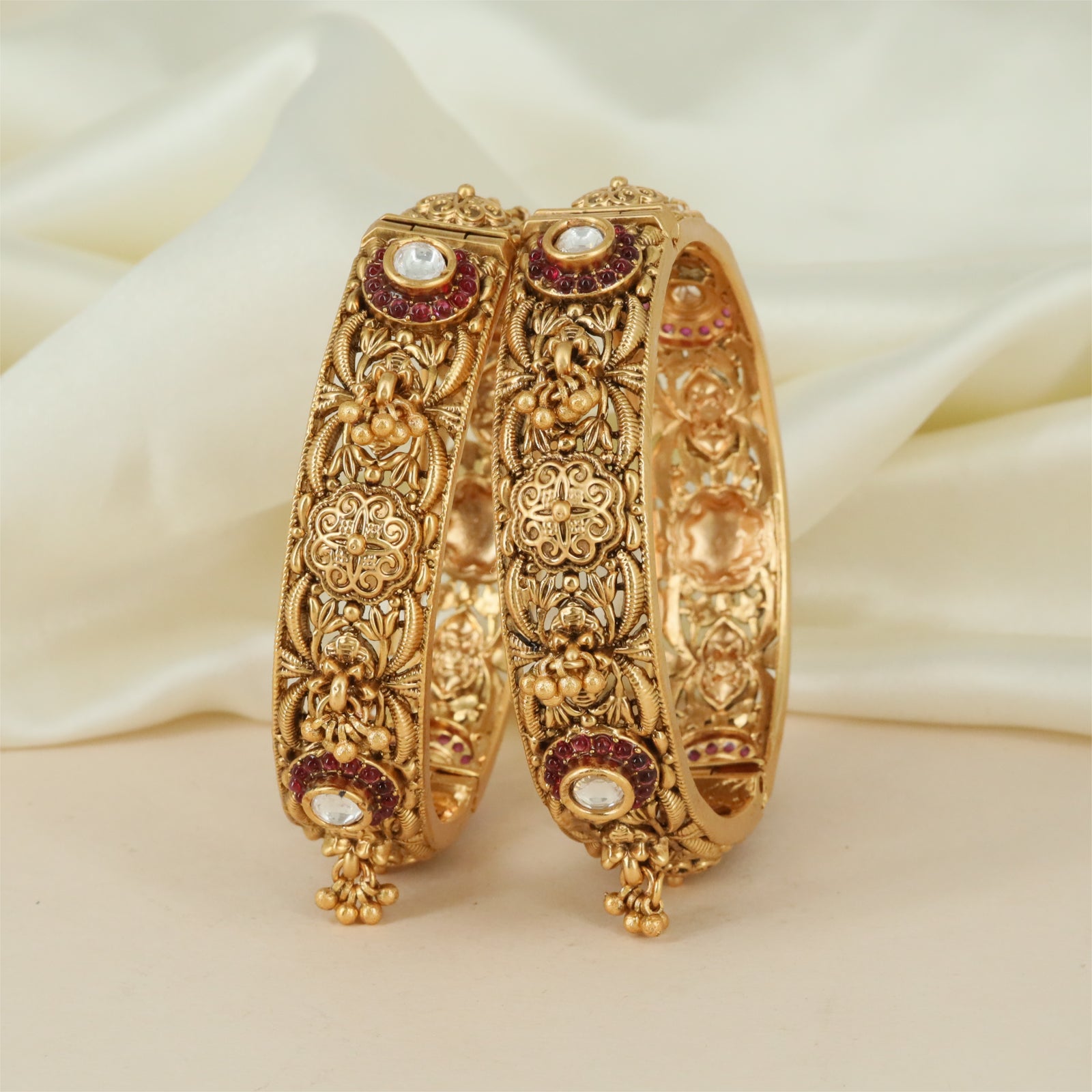 Royal Frame Antique Bangles with Floral Carved Panels and Hanging Drops