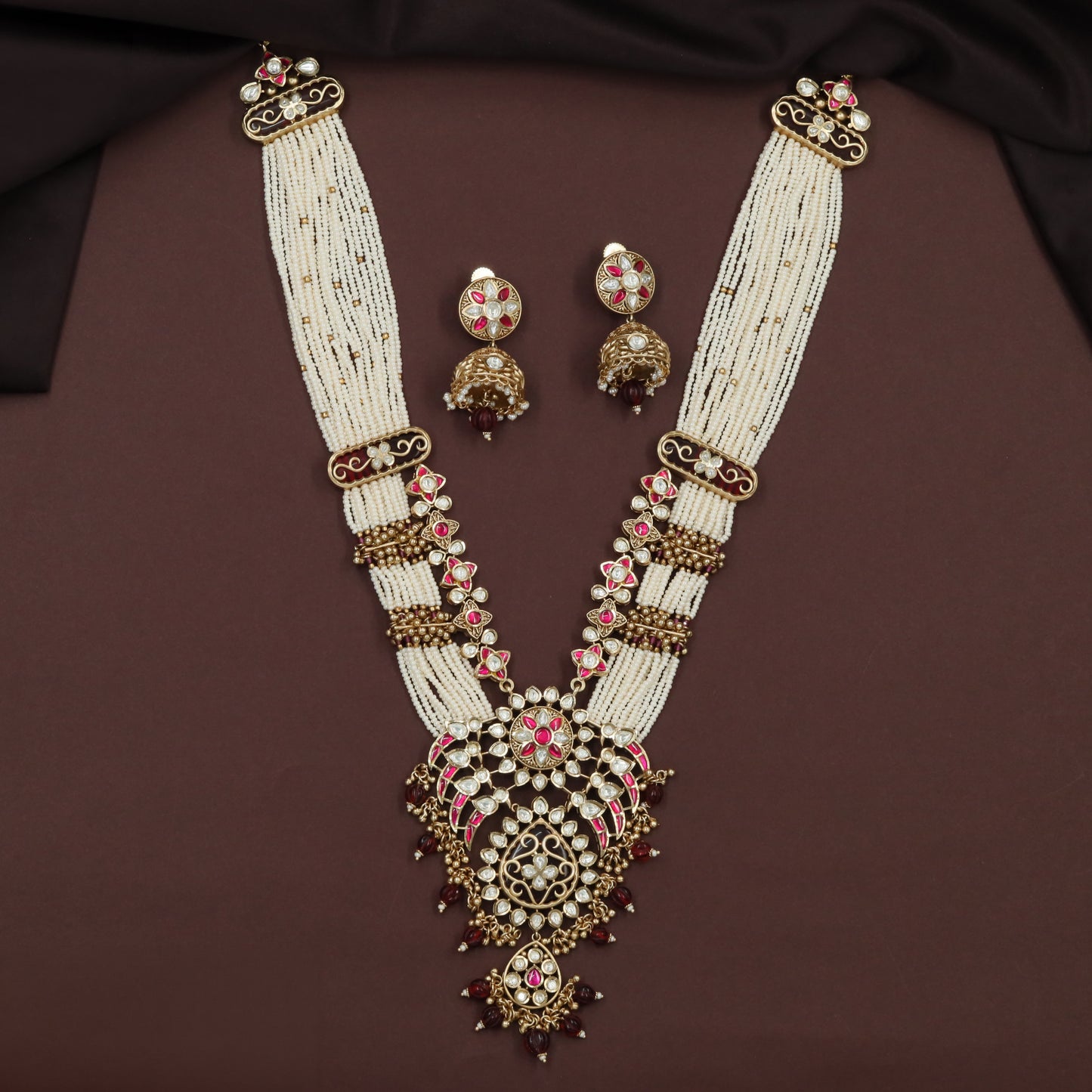 Kundan Long Haara with Curved Link Panels and Decorative Drop Pendant