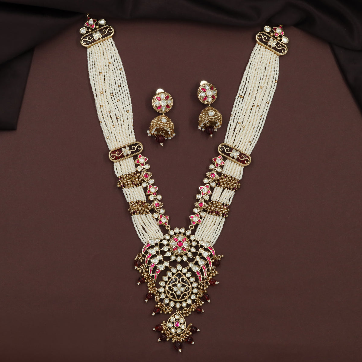 Kundan Long Haara with Curved Link Panels and Decorative Drop Pendant