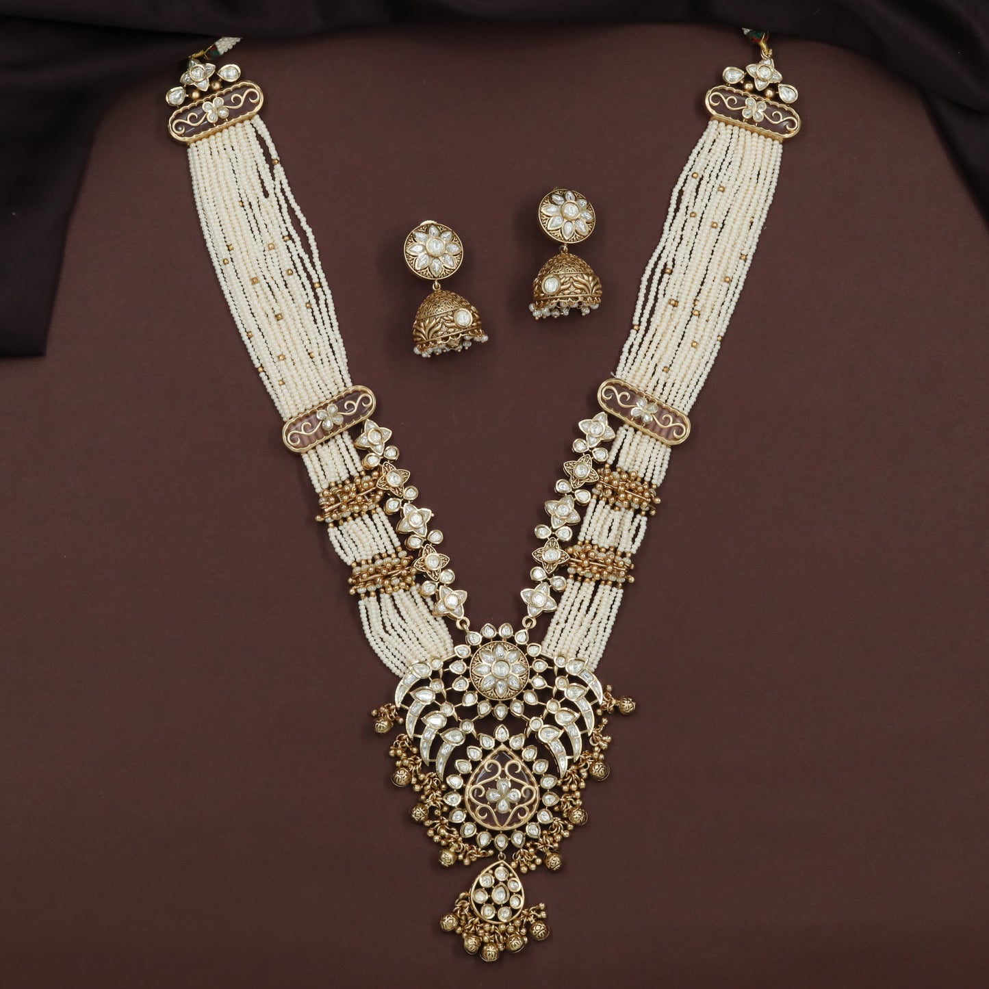 Kundan Long Haara with Curved Link Panels and Decorative Drop Pendant