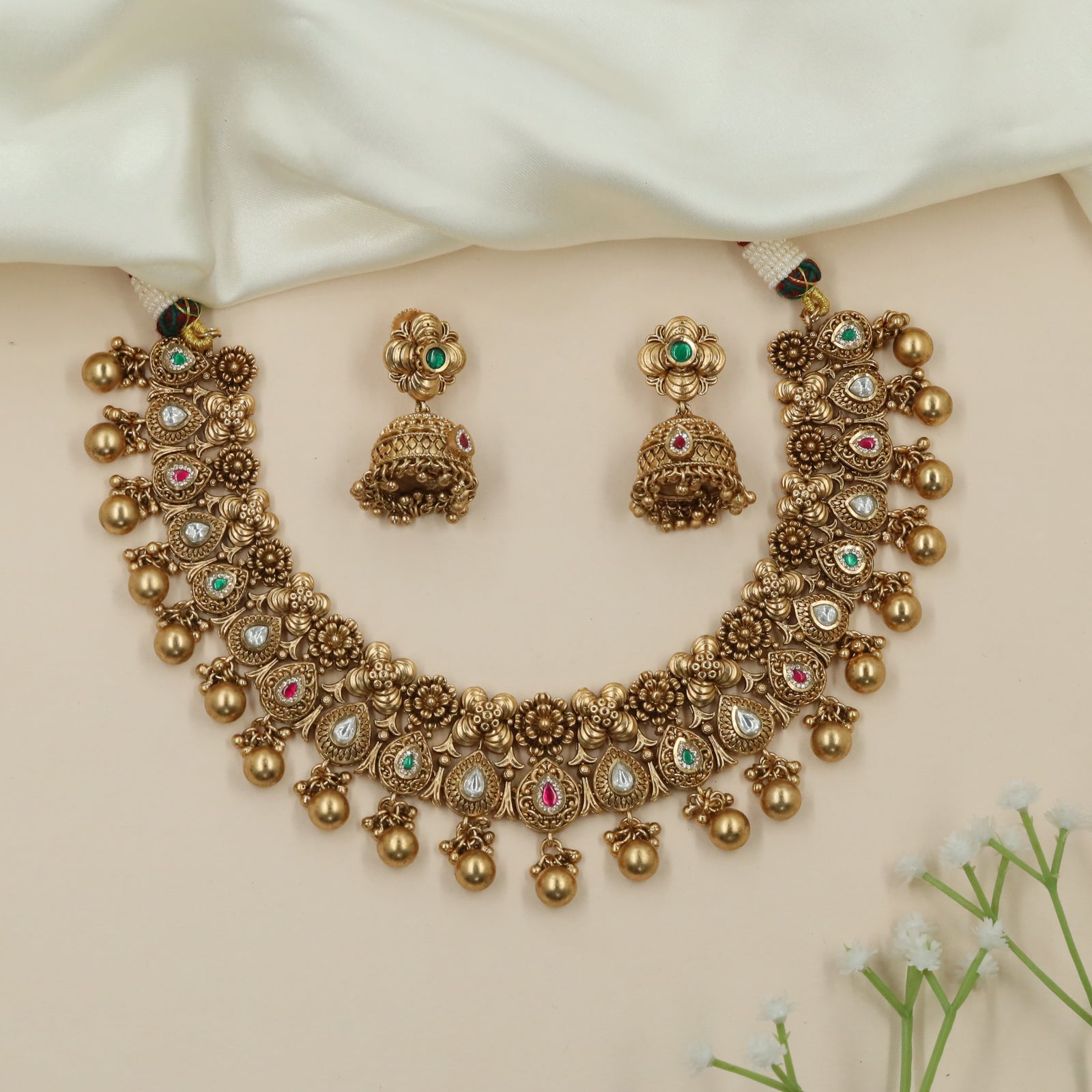 Dewline Floral Kundan Necklace with Hanging Ball Tassels