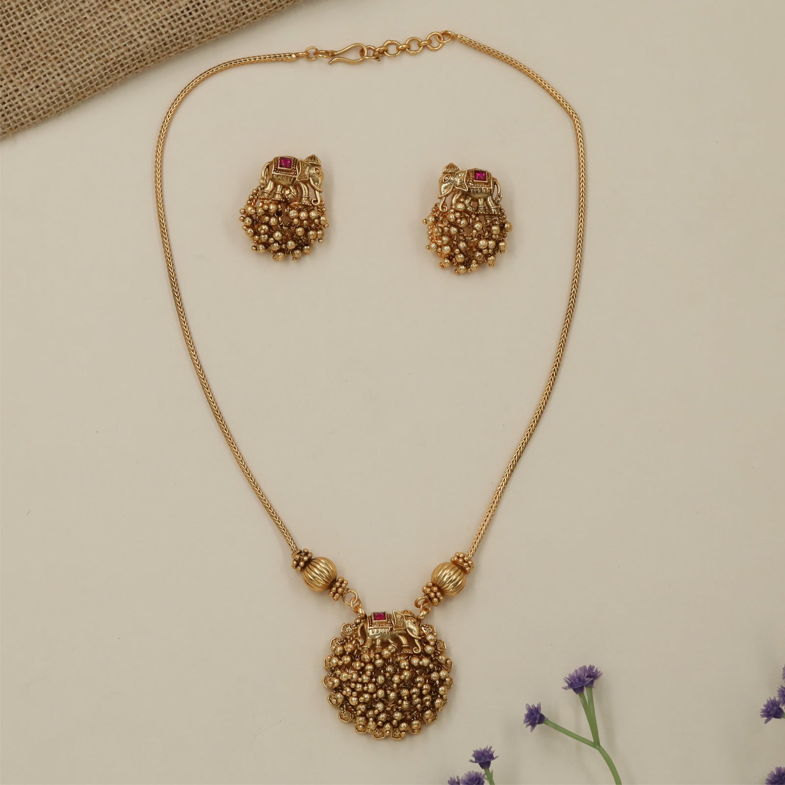 Mythravi Elephant Pendant Antique Necklace with Sculpted Border Work