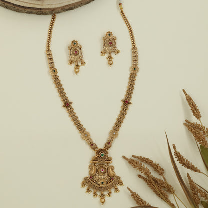 Floral panel long haara with spaced connectors and engraved pendant with drop elements