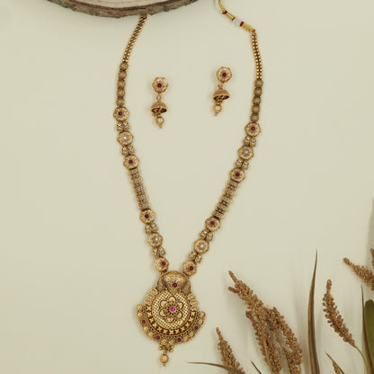 Floral link long haara with repeating disc sections and broad medallion pendant with bead hanging