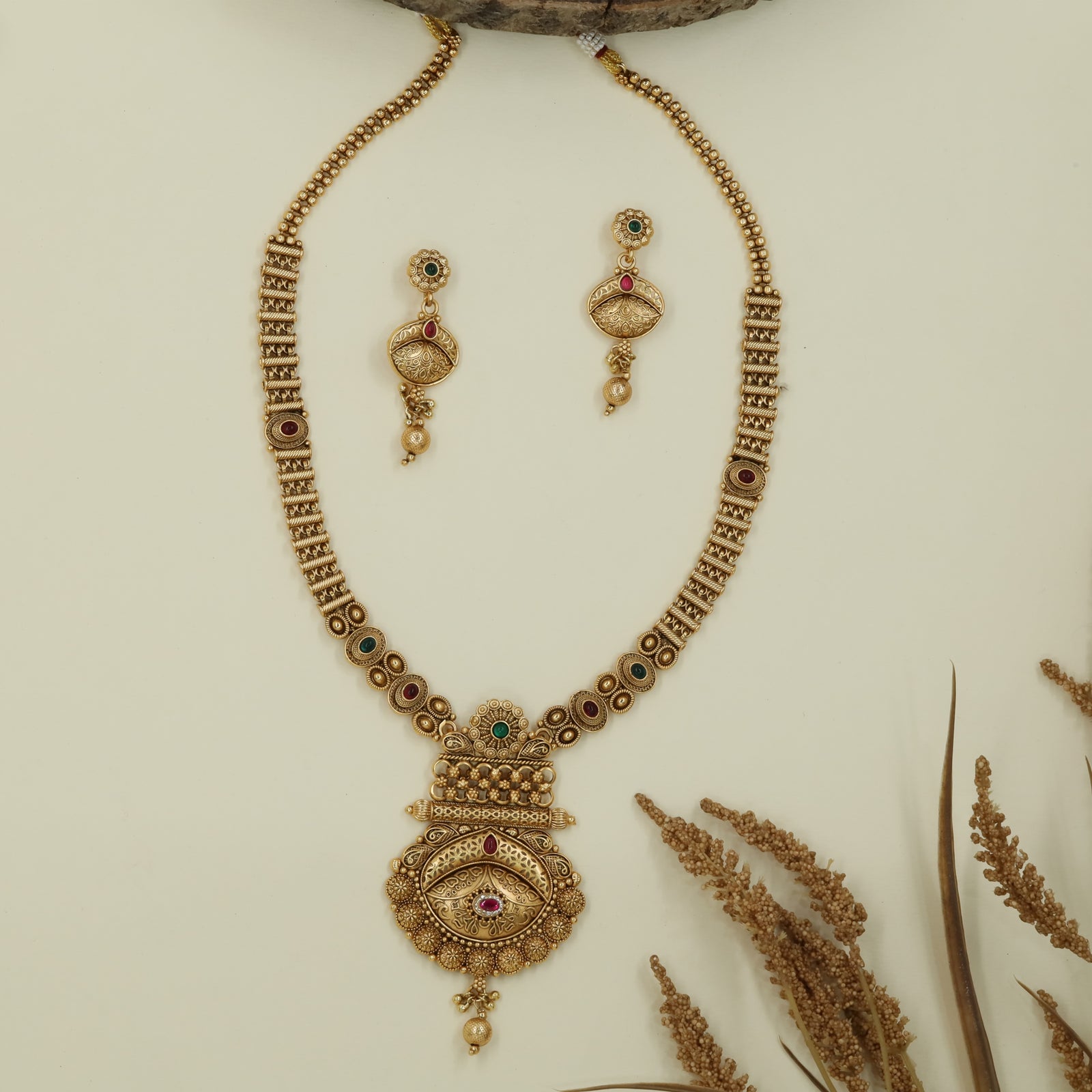 Antique bead long haara with twin strands and layered medallion drop pendant