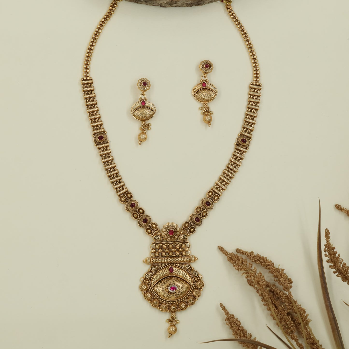 Antique bead long haara with twin strands and layered medallion drop pendant