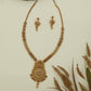 Embossed chain antique long haara with structured links and broad pendant with drop element