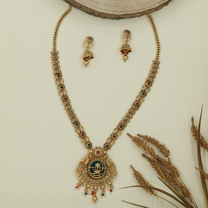 Honeycomb link long haara with patterned connectors and peacock pendant with drop fringe