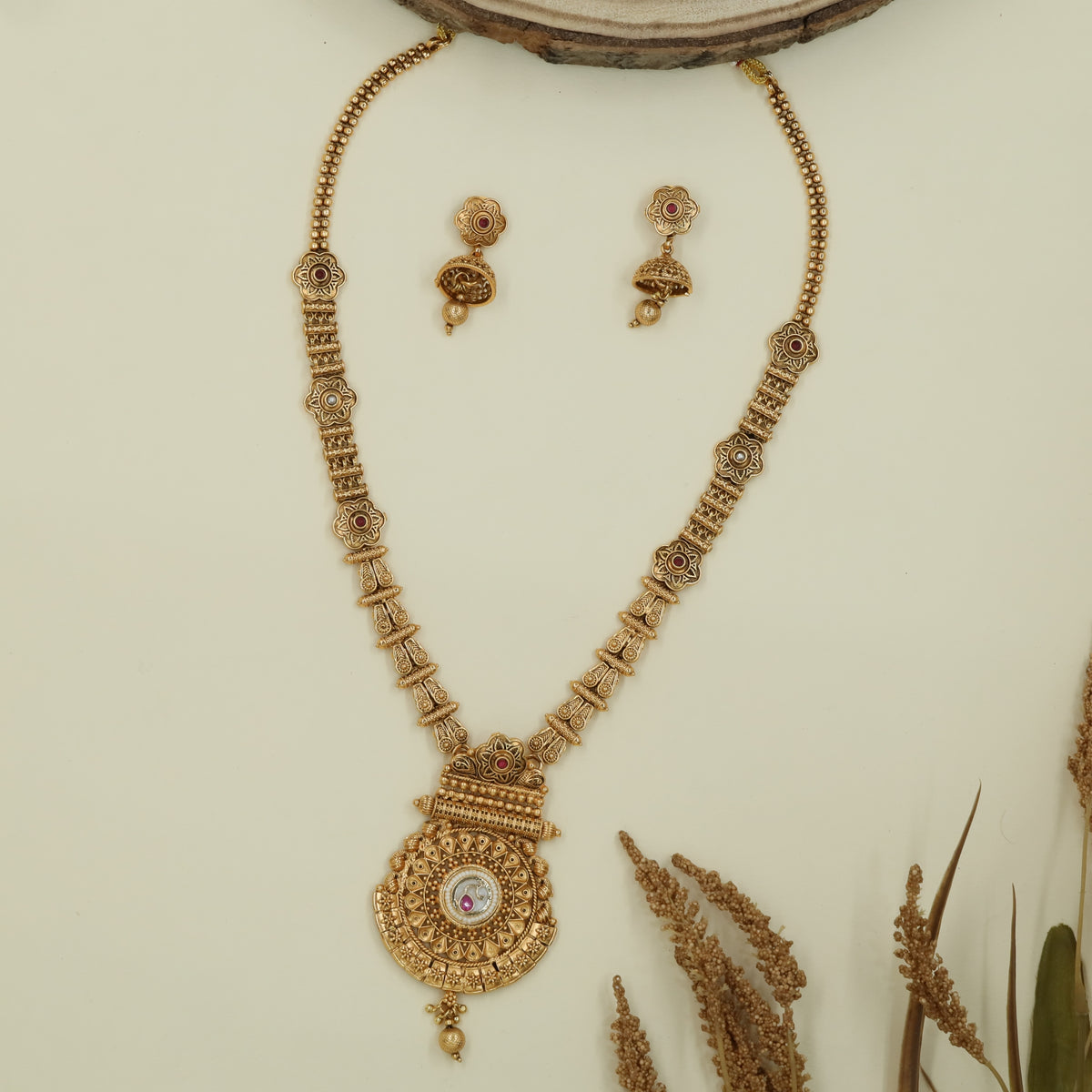 Axis bead long haara with twin strands and circular medallion drop pendant