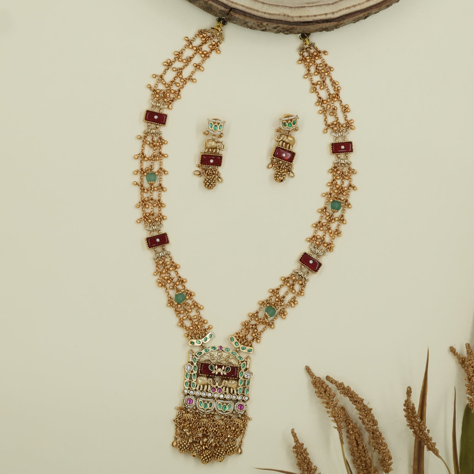 Interlinked bead kundan long haara with dense chain rows and panel connectors with drop tassels