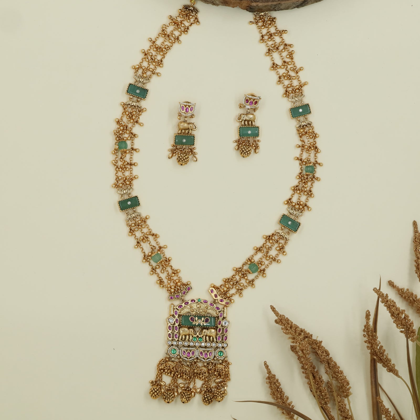 Interlinked bead kundan long haara with dense chain rows and panel connectors with drop tassels