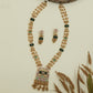 Interlinked bead kundan long haara with dense chain rows and panel connectors with drop tassels
