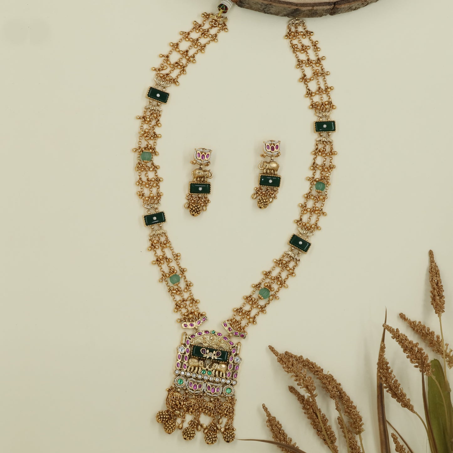 Interlinked bead kundan long haara with dense chain rows and panel connectors with drop tassels